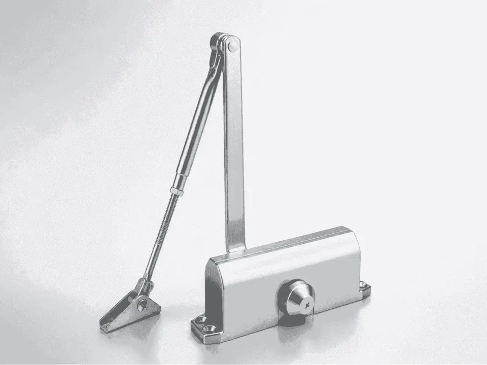 A metallic silver hydraulic door closer mechanism, complete with its main body casing and adjustable jointed arm assembly, is displayed against a clean, light gray background.