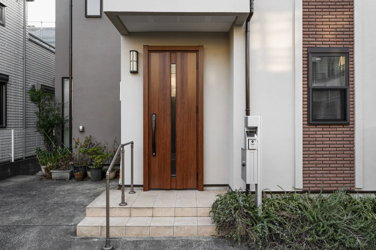 Residential apartment building entrance with video intercom and electric lock panel