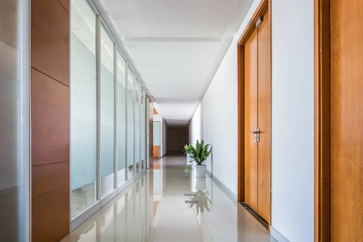 Office wooden door with card reader access control panel beside it