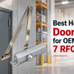 Silver heavy-duty door closer with metal arm above a gray door in a warehouse, with bold headline text on the right.